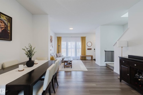 Open-concept living space featuring wood-finish flooring, recessed lighting, and white walls - 5237 Edgemont Boulevard, Edmonton, AB - Indoor Photo Showing Dining Room