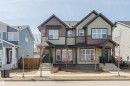 Modern two-story duplex with a blend of horizontal siding and shake accents - 5237 Edgemont Boulevard, Edmonton, AB  - Outdoor With Facade 