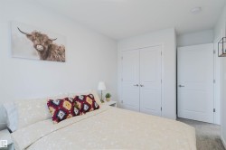 Clean white walls define this room featuring carpet flooring - 