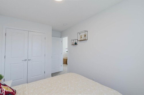 White interior doors with brushed nickel hardware - 5237 Edgemont Boulevard, Edmonton, AB - Indoor Photo Showing Bedroom
