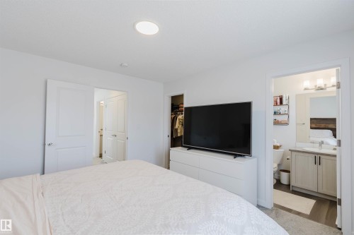 Bedroom featuring a recessed ceiling light, white walls, and carpet flooring - 5237 Edgemont Boulevard, Edmonton, AB - Indoor Photo Showing Bedroom