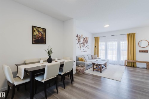 Open-concept living space featuring wood-finish flooring, recessed lighting, and white walls - 5237 Edgemont Boulevard, Edmonton, AB - Indoor Photo Showing Dining Room