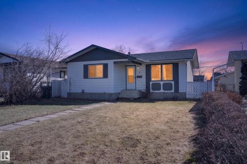 Single-story residence featuring light-colored siding, a dark-toned roof, and contrasting window shutters - 5 Linden St, Spruce Grove, AB - Outdoor