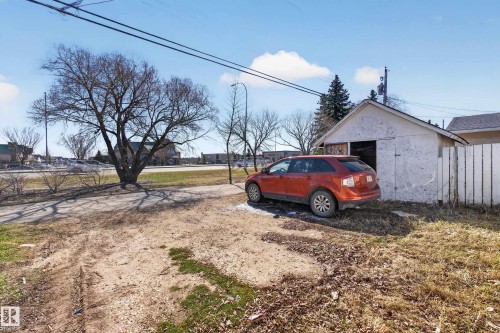 Detached garage featuring a white exterior and an open garage door - 5 Linden St, Spruce Grove, AB - Outdoor
