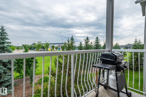 Private balcony with white metal railing and a concrete floor - #314 240 Spruce Ridge Rd, Spruce Grove, AB - Outdoor
