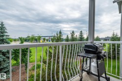 Private balcony with white metal railing and a concrete floor - 