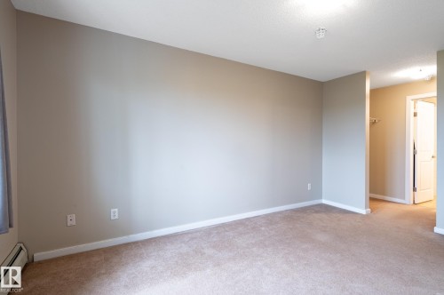 Carpeted interior space with neutral wall tones - #314 240 Spruce Ridge Rd, Spruce Grove, AB - Indoor Photo Showing Other Room