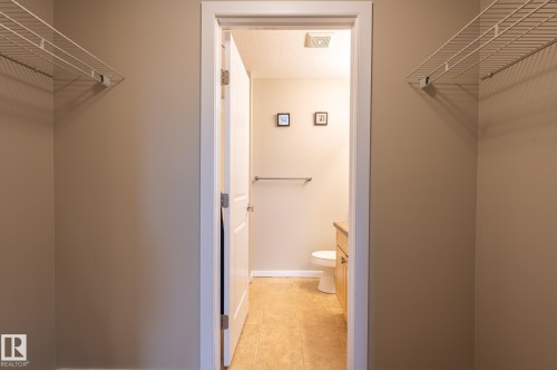 Walk-in closet with dual wire shelving units - #314 240 Spruce Ridge Rd, Spruce Grove, AB - Indoor