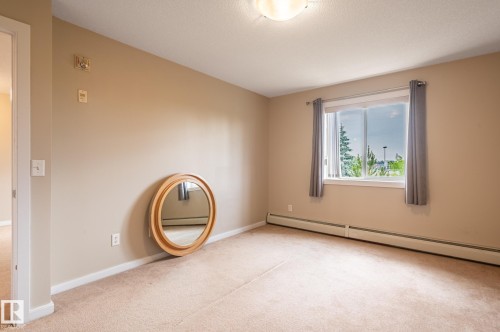 Neutral-toned walls complement the carpeted flooring - #314 240 Spruce Ridge Rd, Spruce Grove, AB - Indoor Photo Showing Other Room