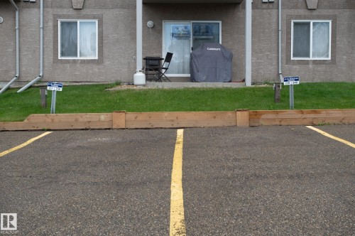 Paved parking area featuring clear yellow stripe markings - #314 240 Spruce Ridge Rd, Spruce Grove, AB - Outdoor