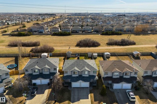 Row of detached homes with attached garages - 2923 30 Street, Edmonton, AB - Outdoor