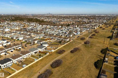 Expansive residential area featuring numerous single-family homes and townhouses under a clear sky - 2923 30 Street, Edmonton, AB - Outdoor With View