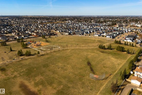 Expansive green space featuring a playground, walking paths, and a baseball diamond - 2923 30 Street, Edmonton, AB - Outdoor With View