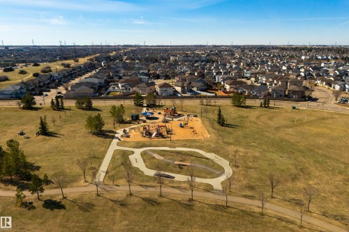 Aerial perspective showcasing a community park with a playground structure and paved walking paths - 2923 30 Street, Edmonton, AB - Outdoor With View