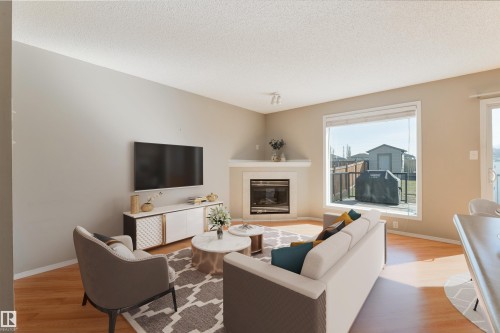 Virtually staged - 2923 30 Street, Edmonton, AB - Indoor Photo Showing Living Room With Fireplace