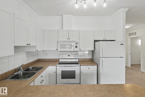 228 8528 82 Avenue, Edmonton, AB - Indoor Photo Showing Kitchen With Double Sink