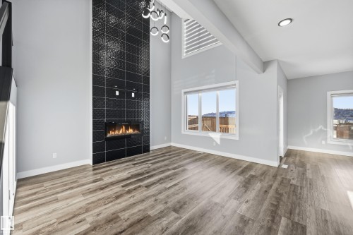 829 Morris Avenue, Leduc, AB - Indoor Photo Showing Other Room With Fireplace