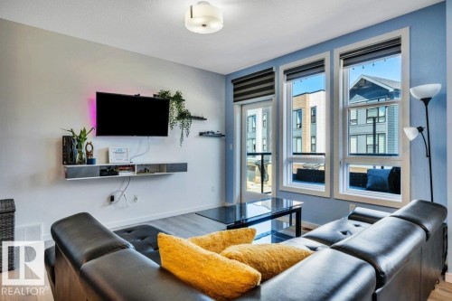 105 1304 Rutherford Rd Road, Edmonton, AB - Indoor Photo Showing Living Room