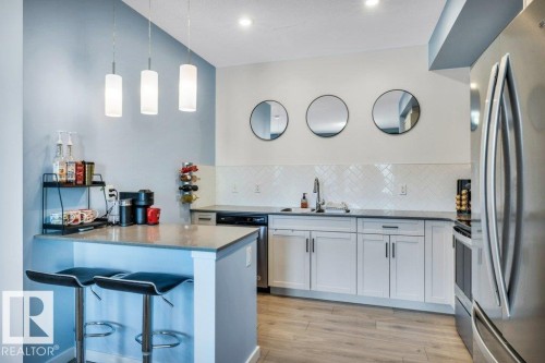 105 1304 Rutherford Rd Road, Edmonton, AB - Indoor Photo Showing Kitchen With Stainless Steel Kitchen With Upgraded Kitchen