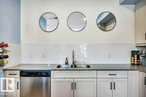 105 1304 Rutherford Rd Road, Edmonton, AB - Indoor Photo Showing Kitchen With Double Sink