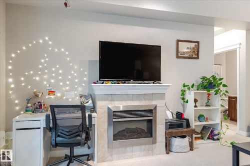 105 10333 112 Street, Edmonton, AB - Indoor Photo Showing Living Room With Fireplace