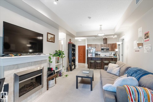 105 10333 112 Street, Edmonton, AB - Indoor Photo Showing Living Room With Fireplace