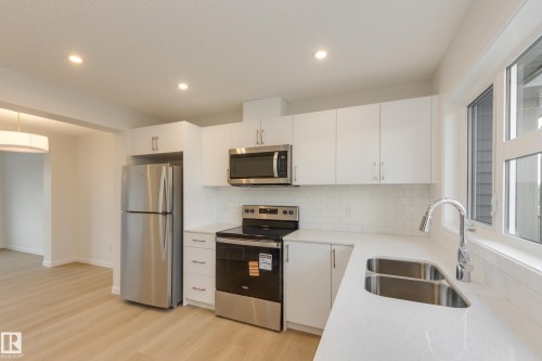 17226 4 Street Nw, Edmonton, AB - Indoor Photo Showing Kitchen With Stainless Steel Kitchen With Double Sink