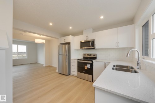 17226 4 Street Nw, Edmonton, AB - Indoor Photo Showing Kitchen With Stainless Steel Kitchen With Double Sink
