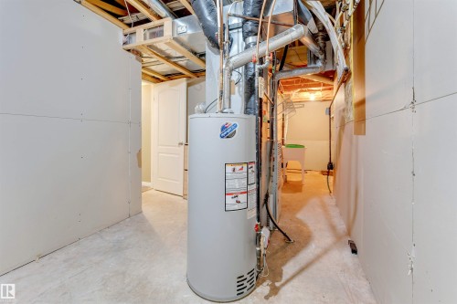 Water heater system prominently positioned - 4812 148 Avenue, Edmonton, AB - Indoor Photo Showing Basement