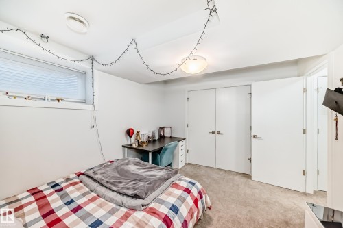 Carpeted room with a built-in window and overhead lighting - 14812 98 Avenue, Edmonton, AB - Indoor Photo Showing Bedroom