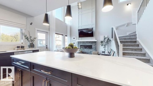 5892 Raven Crescent, Edmonton, AB - Indoor Photo Showing Kitchen With Fireplace