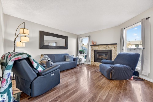 3584 42 Street, Edmonton, AB - Indoor Photo Showing Living Room With Fireplace