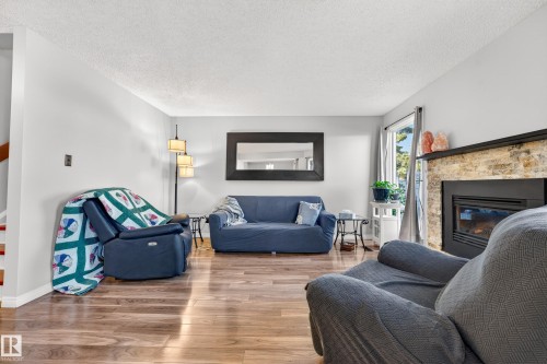 3584 42 Street, Edmonton, AB - Indoor Photo Showing Living Room With Fireplace