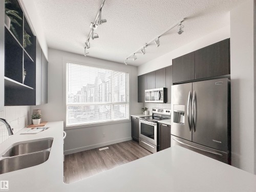 21 100 Jensen Lakes Boulevard, St. Albert, AB - Indoor Photo Showing Kitchen With Double Sink