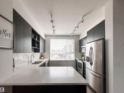 21 100 Jensen Lakes Boulevard, St. Albert, AB - Indoor Photo Showing Kitchen With Double Sink