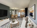 Open-concept living space with carpeted flooring, a dedicated dining area featuring a pendant light fixture, and a kitchen with wood cabinetry and stainless steel appliances - 224 16807 100 Avenue, Edmonton, AB  - Indoor Photo Showing Living Room 