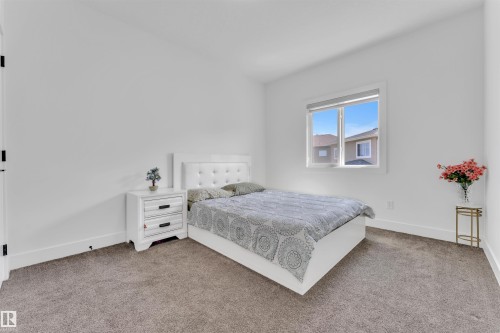 Bedroom with neutral wall paint, white trim, and gray carpet flooring - 1809 18A Avenue, Edmonton, AB - Indoor Photo Showing Bedroom