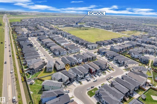 Residential neighborhood with a school building and athletic field - 1809 18A Avenue, Edmonton, AB - Outdoor With View