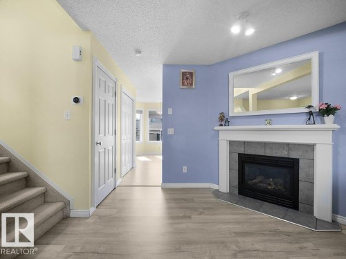4519 149 Avenue, Edmonton, AB - Indoor Photo Showing Living Room With Fireplace