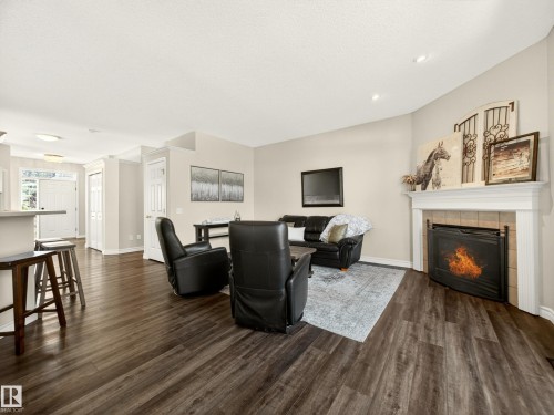 7 Oakbay Point(E), St. Albert, AB - Indoor Photo Showing Living Room With Fireplace