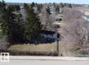 Single-story residence featuring a light-colored exterior and a dark roof - 5010 50 Street, Ardmore, AB 