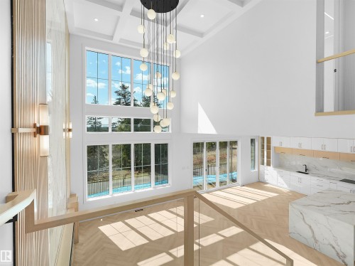 Two-story living area with coffered ceiling and a multi-globe chandelier - 2070 Collip Crescent, Edmonton, AB - Indoor Photo Showing Other Room