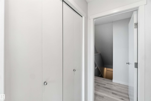 Double bifold closet doors with satin nickel hardware - 22371 93 Avenue, Edmonton, AB - Indoor Photo Showing Other Room