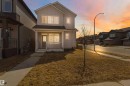 Two-story residential structure featuring light-toned siding and a covered front porch - 22371 93 Avenue, Edmonton, AB  - Outdoor 