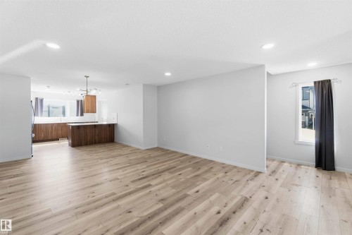Open concept living space featuring wood-finish flooring throughout - 22371 93 Avenue, Edmonton, AB - Indoor