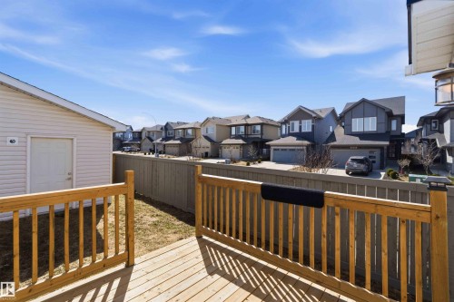Expansive wood deck with natural wood railing overlooking a fenced yard - 22371 93 Avenue, Edmonton, AB - Outdoor With Deck Patio Veranda With Exterior