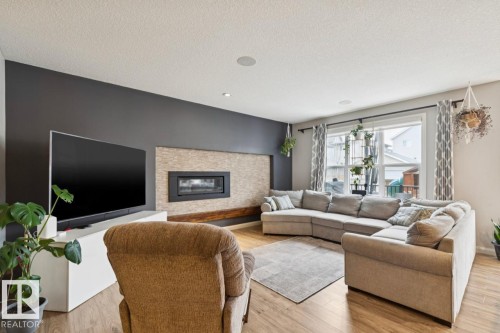 1351 Secord Landing Landing, Edmonton, AB - Indoor Photo Showing Living Room With Fireplace