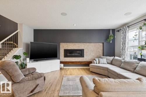 1351 Secord Landing Landing, Edmonton, AB - Indoor Photo Showing Living Room With Fireplace