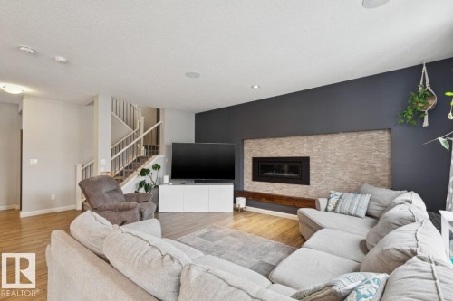 1351 Secord Landing Landing, Edmonton, AB - Indoor Photo Showing Living Room With Fireplace