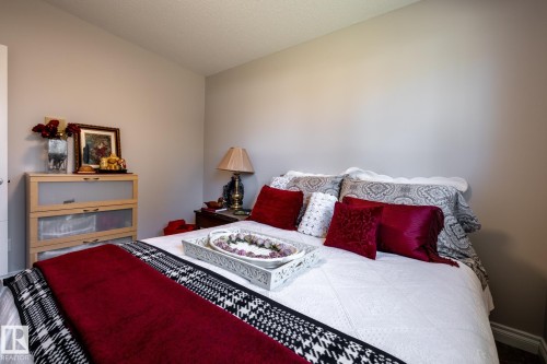 Recessed ceiling, neutral wall paint, and baseboard molding define this interior space - 16536 103 Street, Edmonton, AB - Indoor Photo Showing Bedroom